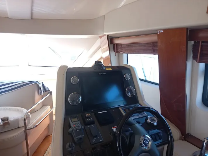  Yacht Photos Pics Interior helm of 2009 Sea Ray 505 Sedan Bridge yacht with navigation equipment.