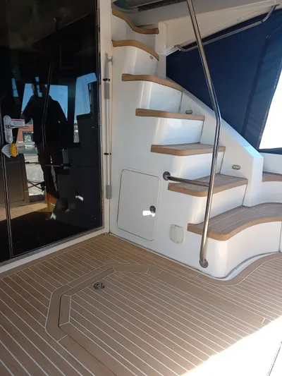  Yacht Photos Pics 2009 Sea Ray 505 Sedan Bridge yacht with elegant wooden stairs and sleek interior design.