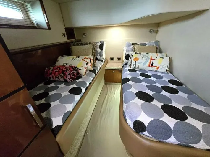  Yacht Photos Pics Twin beds in 2009 Sea Ray 505 Sedan Bridge cabin with polka dot bedding.