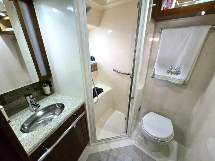  Yacht Photos Pics Luxurious bathroom in 2009 Sea Ray 505 Sedan Bridge yacht, featuring shower, sink, and toilet.