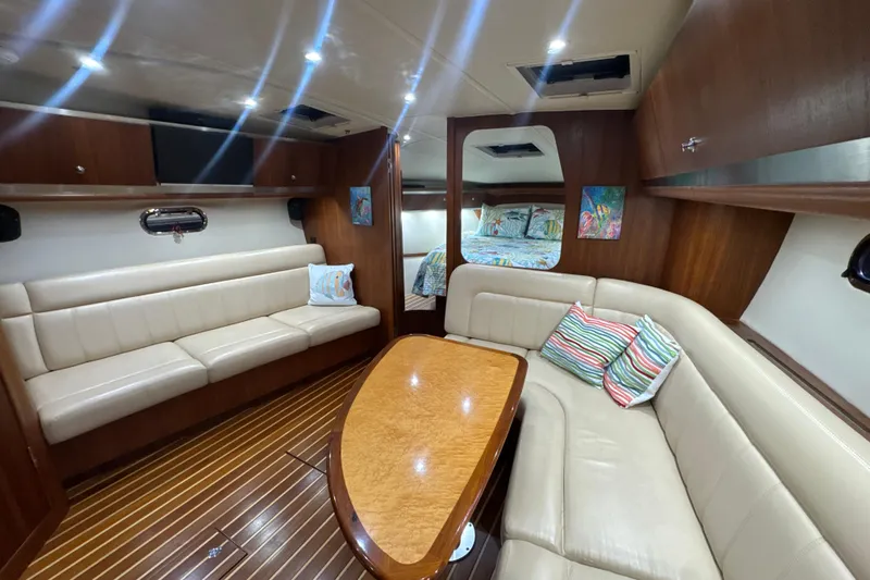 Blue Sky Yacht Photos Pics Luxurious interior of 2006 Tiara Yachts 3600 Sovran with elegant seating and wooden finishes.