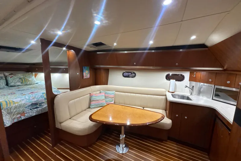 Blue Sky Yacht Photos Pics Luxurious interior of 2006 Tiara Yachts 3600 Sovran with cozy seating and kitchenette.