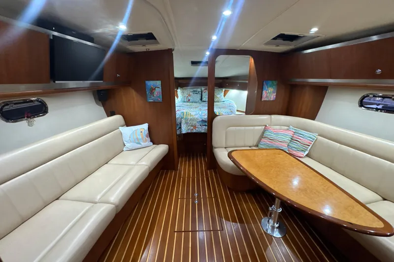 Blue Sky Yacht Photos Pics Luxurious interior of 2006 Tiara Yachts 3600 Sovran with elegant seating and wood finishes.