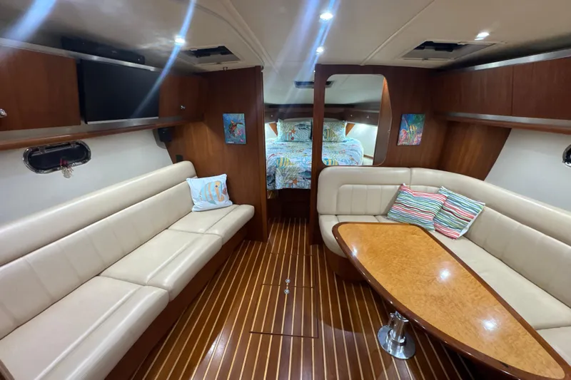Blue Sky Yacht Photos Pics Luxurious interior of 2006 Tiara Yachts 3600 Sovran with elegant seating and wood finishes.