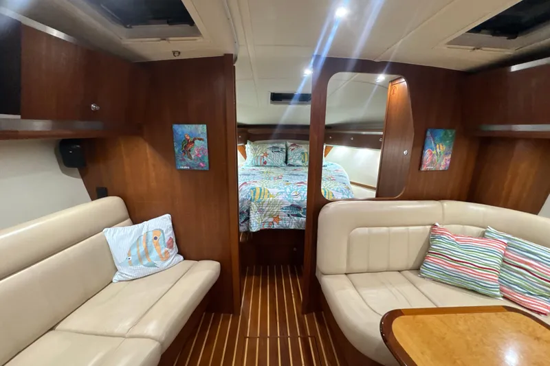 Blue Sky Yacht Photos Pics 2006 Tiara Yachts 3600 Sovran interior with cozy seating and vibrant decor.