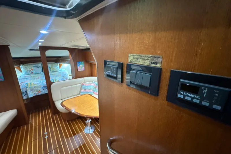 Blue Sky Yacht Photos Pics 2006 Tiara Yachts 3600 Sovran interior with cozy seating and modern controls.