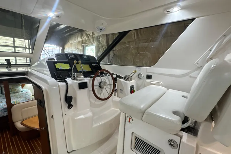 Blue Sky Yacht Photos Pics 2006 Tiara Yachts 3600 Sovran helm with navigation equipment and comfortable seating.