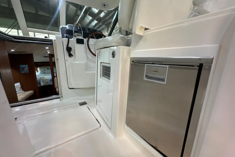 Blue Sky Yacht Photos Pics 2006 Tiara Yachts 3600 Sovran interior with helm, seating, and cabin view.