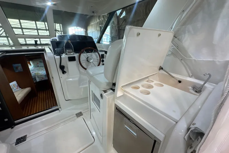 Blue Sky Yacht Photos Pics 2006 Tiara Yachts 3600 Sovran interior with helm, seating, and cabin view.