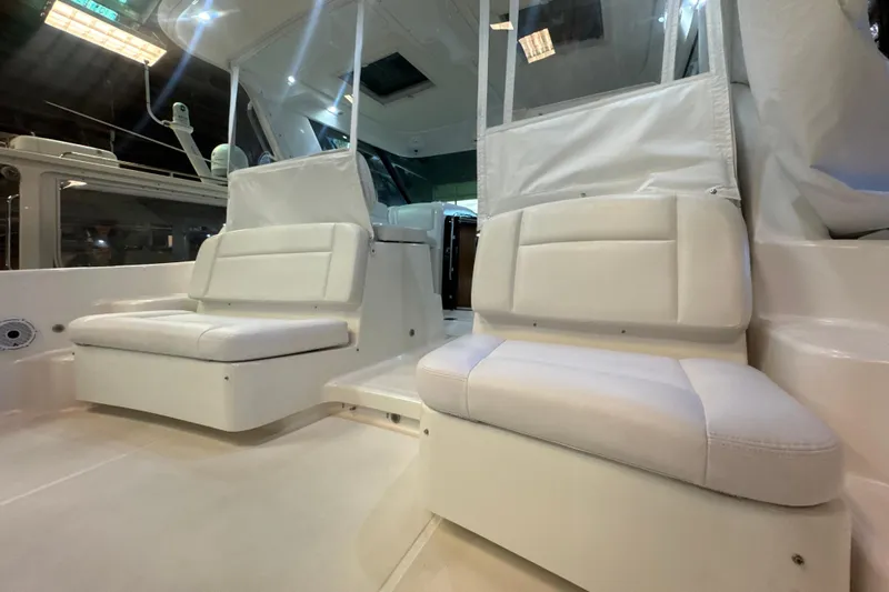 Blue Sky Yacht Photos Pics 2006 Tiara Yachts 3600 Sovran interior with white cushioned seating.