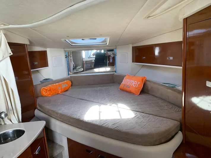 Summer Of Bob Yacht Photos Pics 2011 Sea Ray 330 Sundancer cabin with cozy bed and orange pillows.