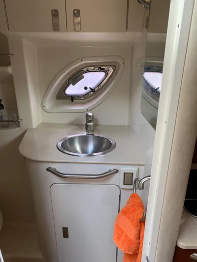 Summer Of Bob Yacht Photos Pics 2011 Sea Ray 330 Sundancer bathroom with sink, porthole, and orange towel.