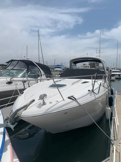 Summer Of Bob Yacht Photos Pics 2011 Sea Ray 330 Sundancer docked at marina under cloudy sky.