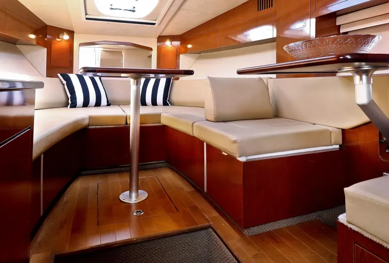 St Babyn Yacht Photos Pics Luxurious interior of 2012 Sea Ray Sundancer 310 yacht with elegant seating and wooden finishes.