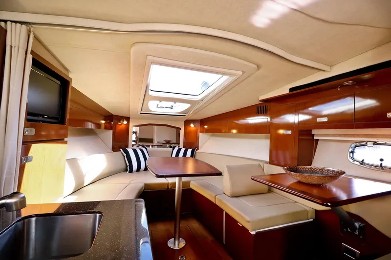 St Babyn Yacht Photos Pics Luxurious interior of 2012 Sea Ray Sundancer 310 yacht with elegant seating and skylight.