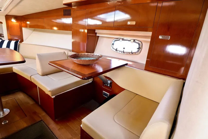 St Babyn Yacht Photos Pics Interior of 2012 Sea Ray Sundancer 310 with elegant wood finish and cozy seating.