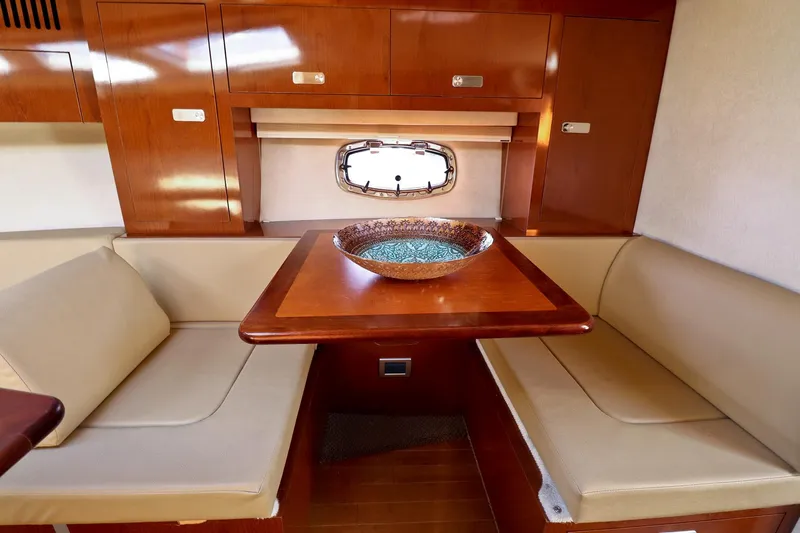 St Babyn Yacht Photos Pics Interior of 2012 Sea Ray Sundancer 310 with cozy seating and wooden table.