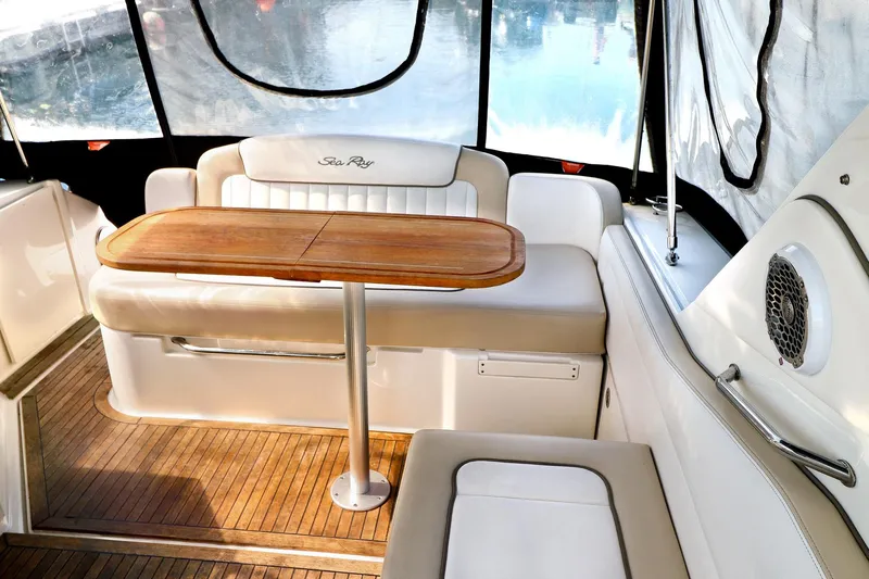 St Babyn Yacht Photos Pics Interior of 2012 Sea Ray Sundancer 310 yacht with seating and wooden table.