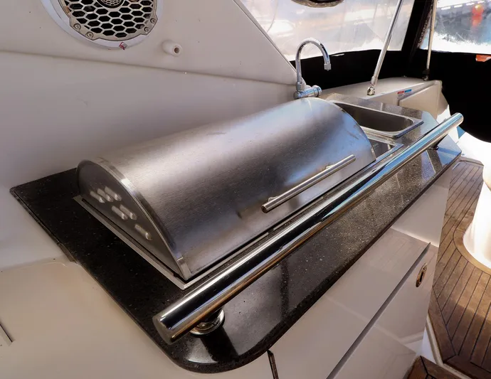 St Babyn Yacht Photos Pics Outdoor kitchen area on a 2012 Sea Ray Sundancer 310 yacht with grill and sink.