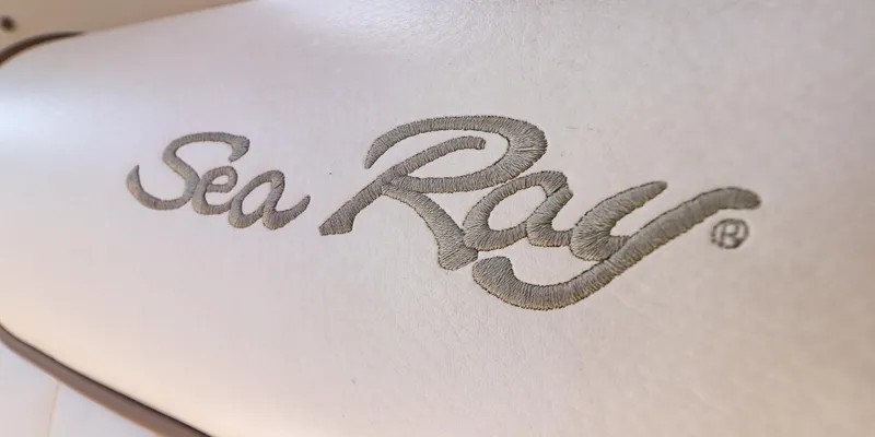 St Babyn Yacht Photos Pics Sea Ray logo on 2012 Sundancer 310 boat upholstery, showcasing elegant design.