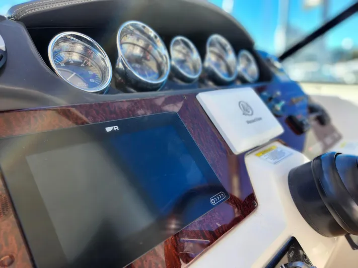 St Babyn Yacht Photos Pics Dashboard of a 2012 Sea Ray Sundancer 310 boat with gauges and controls.