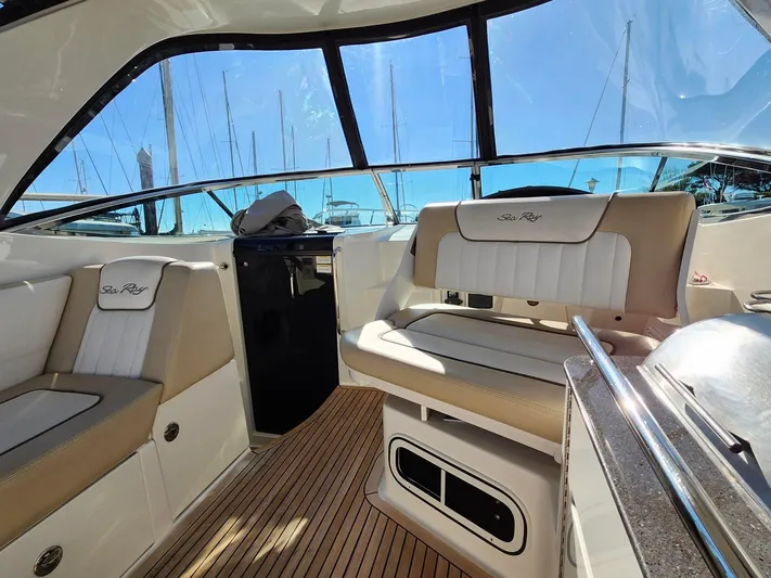 St Babyn Yacht Photos Pics 2012 Sea Ray Sundancer 310 interior with beige seating and wood flooring.