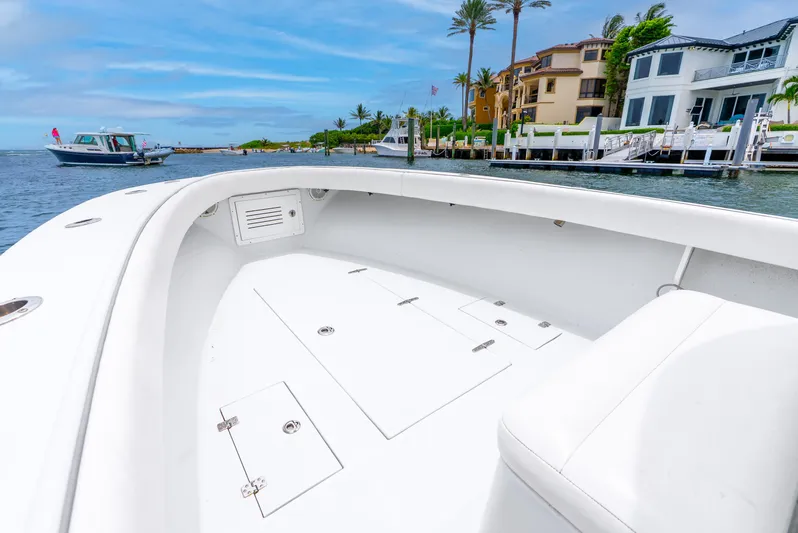  Yacht Photos Pics 2018 Ocean Runner 29 boat interior with waterfront view and luxury homes.