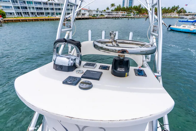  Yacht Photos Pics Control panel of a 2018 Ocean Runner 29 boat on the water.