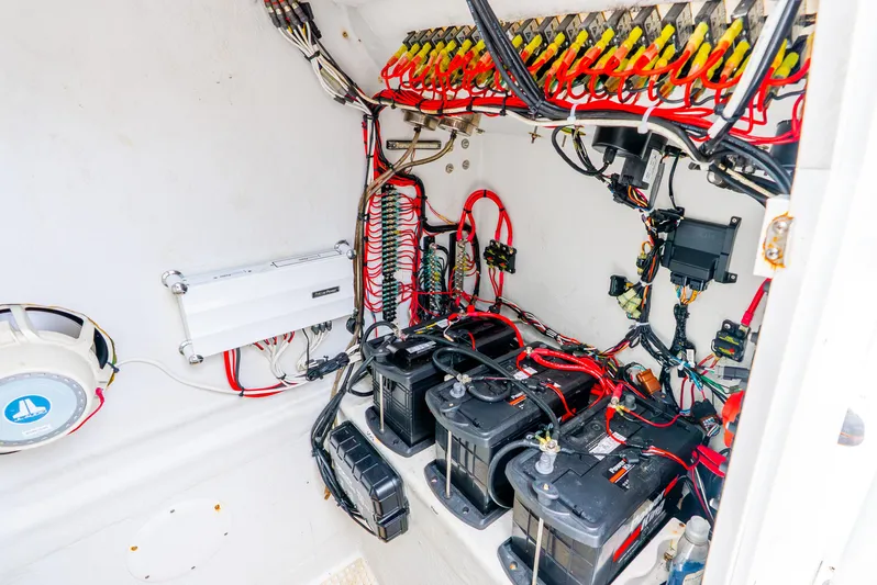  Yacht Photos Pics Electrical system of a 2018 Ocean Runner 29 boat, featuring batteries and wiring.