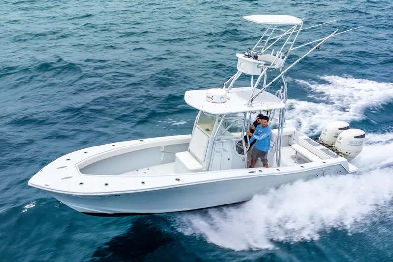  Yacht Photos Pics 2018 Ocean Runner 29 boat cruising on open water with dual engines.