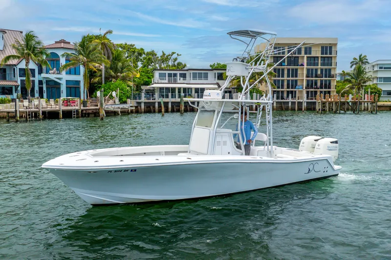  Yacht Photos Pics 2018 Ocean Runner 29 boat cruising near waterfront homes.