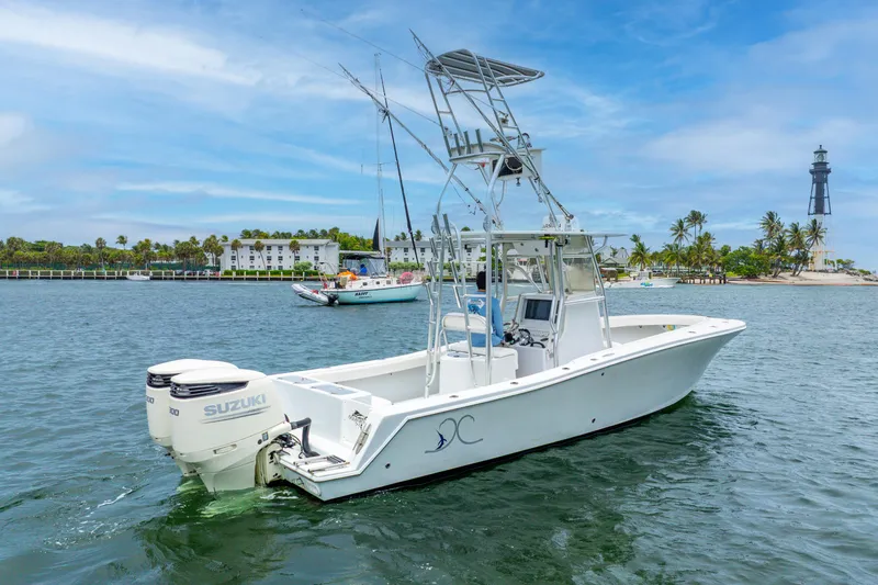  Yacht Photos Pics 2018 Ocean Runner 29 boat with twin Suzuki engines on a scenic waterway.