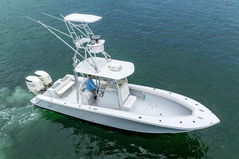  Yacht Photos Pics 2018 Ocean Runner 29 boat cruising on clear blue water.