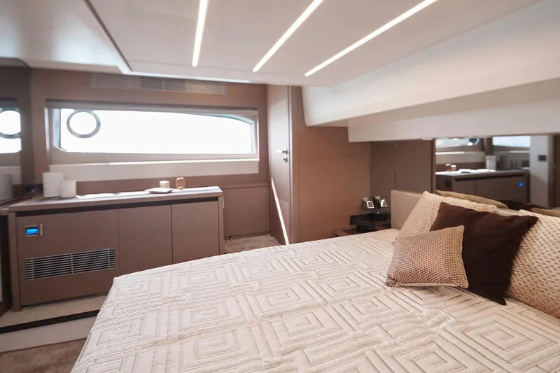 Amarsi Yacht Photos Pics Manufacturer Provided Image: Luxurious bedroom interior of 2023 Prestige 520 yacht with modern design and cozy bedding.