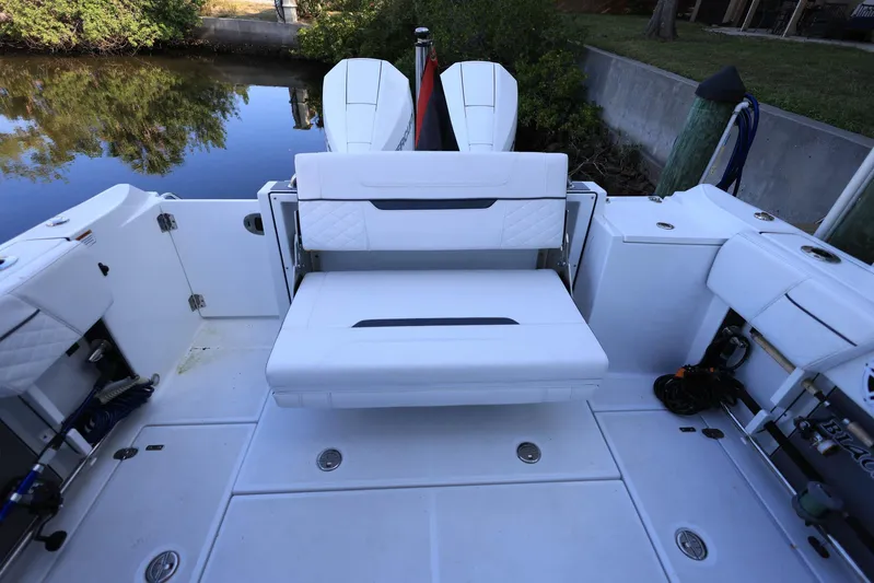  Yacht Photos Pics 2023 Blackfin 252 DC boat interior with white seating and dual engines.