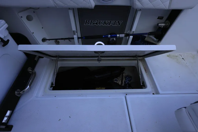  Yacht Photos Pics 2023 Blackfin 252 DC boat storage compartment with open lid, showcasing interior space.