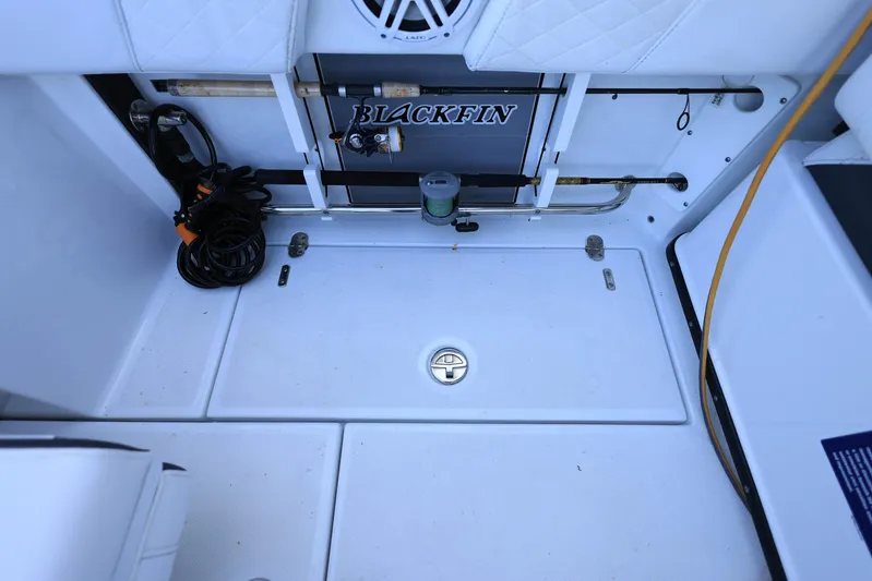  Yacht Photos Pics 2023 Blackfin 252 DC boat interior with storage and equipment.