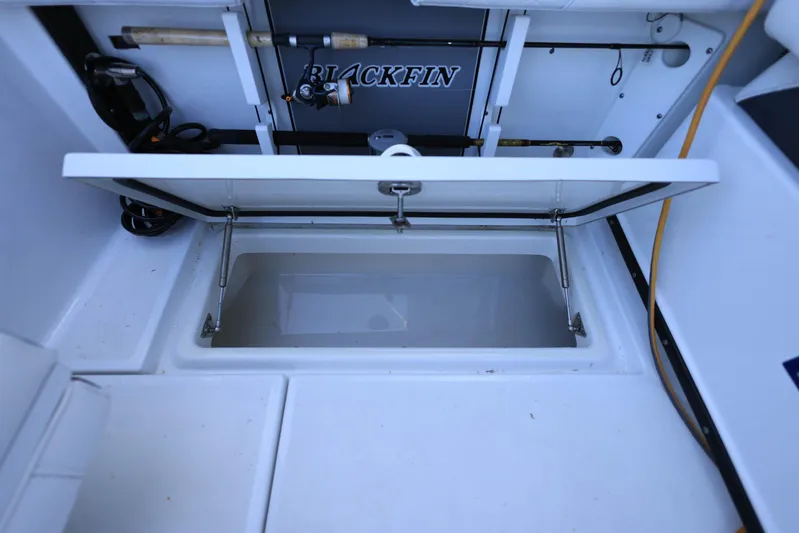  Yacht Photos Pics 2023 Blackfin 252 DC boat storage compartment with open lid, showcasing interior space.
