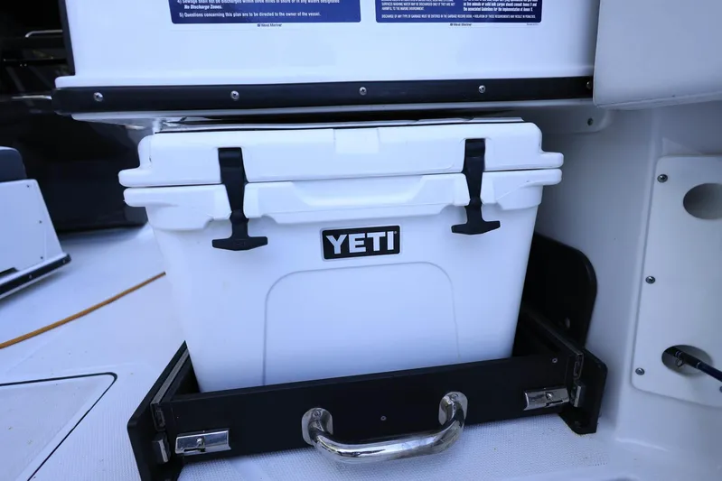  Yacht Photos Pics White YETI cooler in Blackfin 252 DC boat, 2023 model, stored in a pull-out compartment.