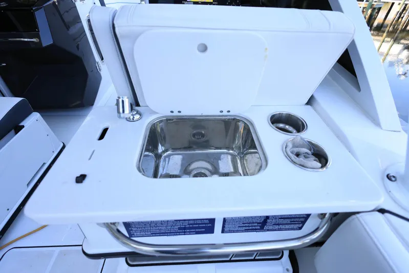  Yacht Photos Pics 2023 Blackfin 252 DC boat sink and cup holders on deck.
