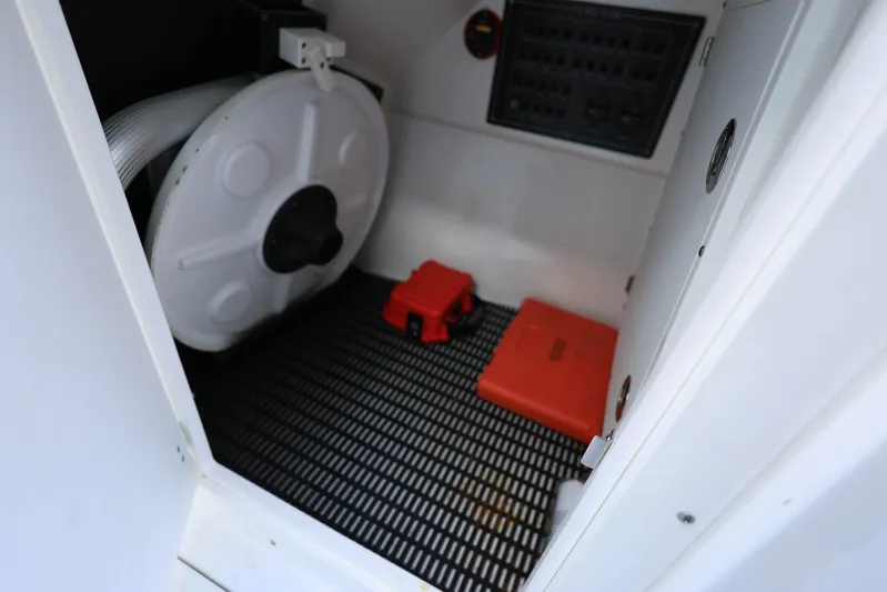  Yacht Photos Pics 2023 Blackfin 252 DC storage compartment with equipment and control panel.