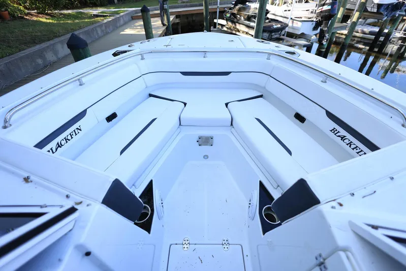  Yacht Photos Pics 2023 Blackfin 252 DC boat interior with white seating and Blackfin branding.