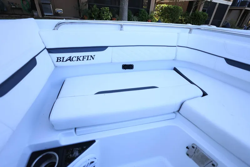  Yacht Photos Pics 2023 Blackfin 252 DC boat interior with white seating and logo.