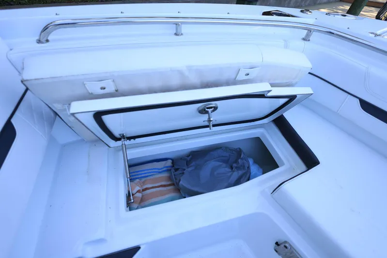  Yacht Photos Pics 2023 Blackfin 252 DC boat storage compartment with open lid, revealing interior space.