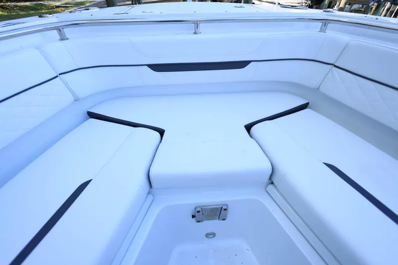  Yacht Photos Pics 2023 Blackfin 252 DC boat interior with white cushioned seating.