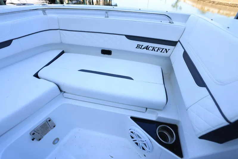  Yacht Photos Pics 2023 Blackfin 252 DC boat interior with white seating and logo detail.