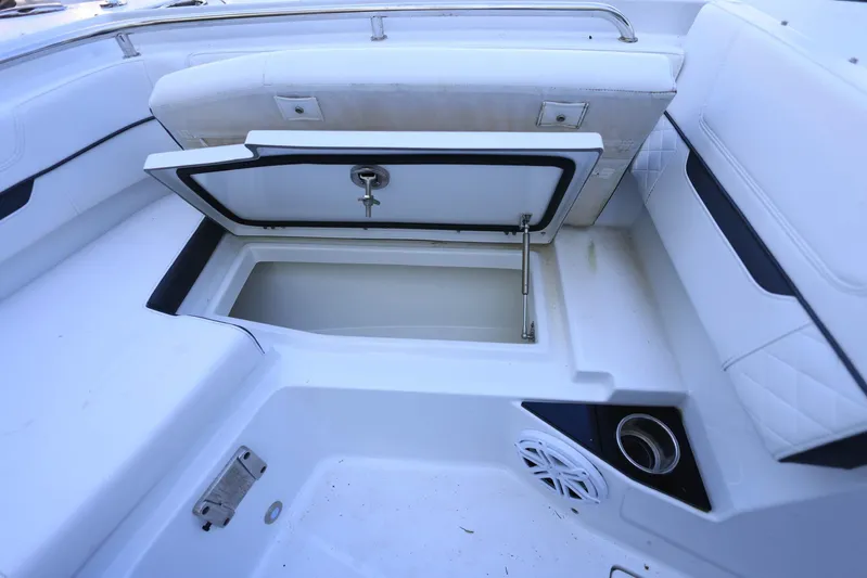  Yacht Photos Pics 2023 Blackfin 252 DC boat interior with open storage compartment and seating.