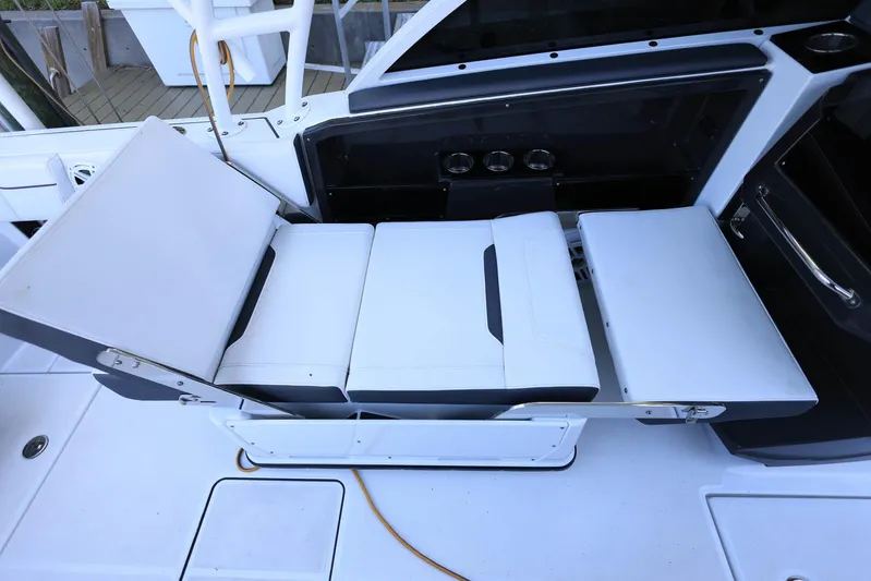  Yacht Photos Pics 2023 Blackfin 252 DC boat with adjustable seating and sleek design.