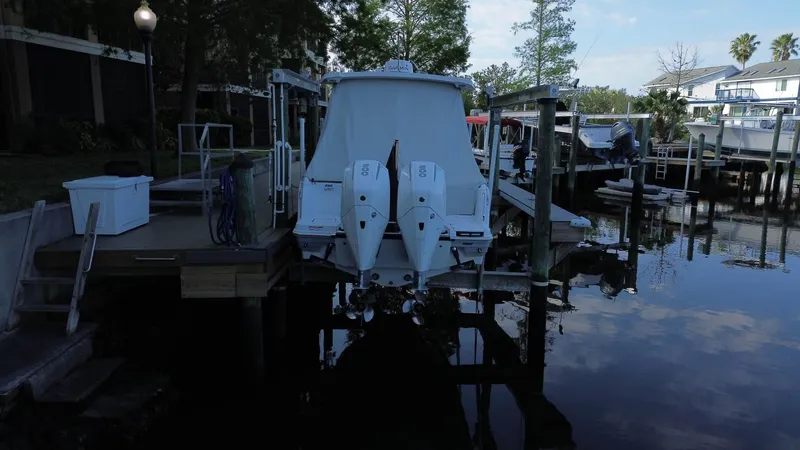  Yacht Photos Pics 2023 Blackfin 252 DC boat docked at a marina with twin engines.