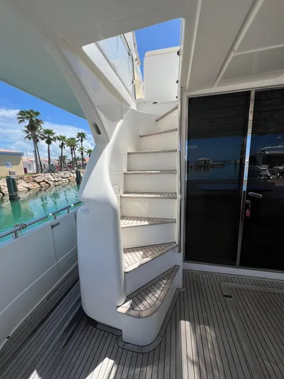 Amia Yacht Photos Pics Staircase on 2006 Ferretti Yachts 731, leading to upper deck, docked at marina.